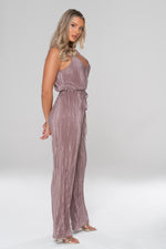 Women' s evening jumpsuit with pleated fabric